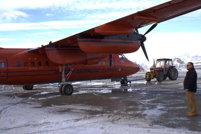 The Dash-7 being pushed into the hangar